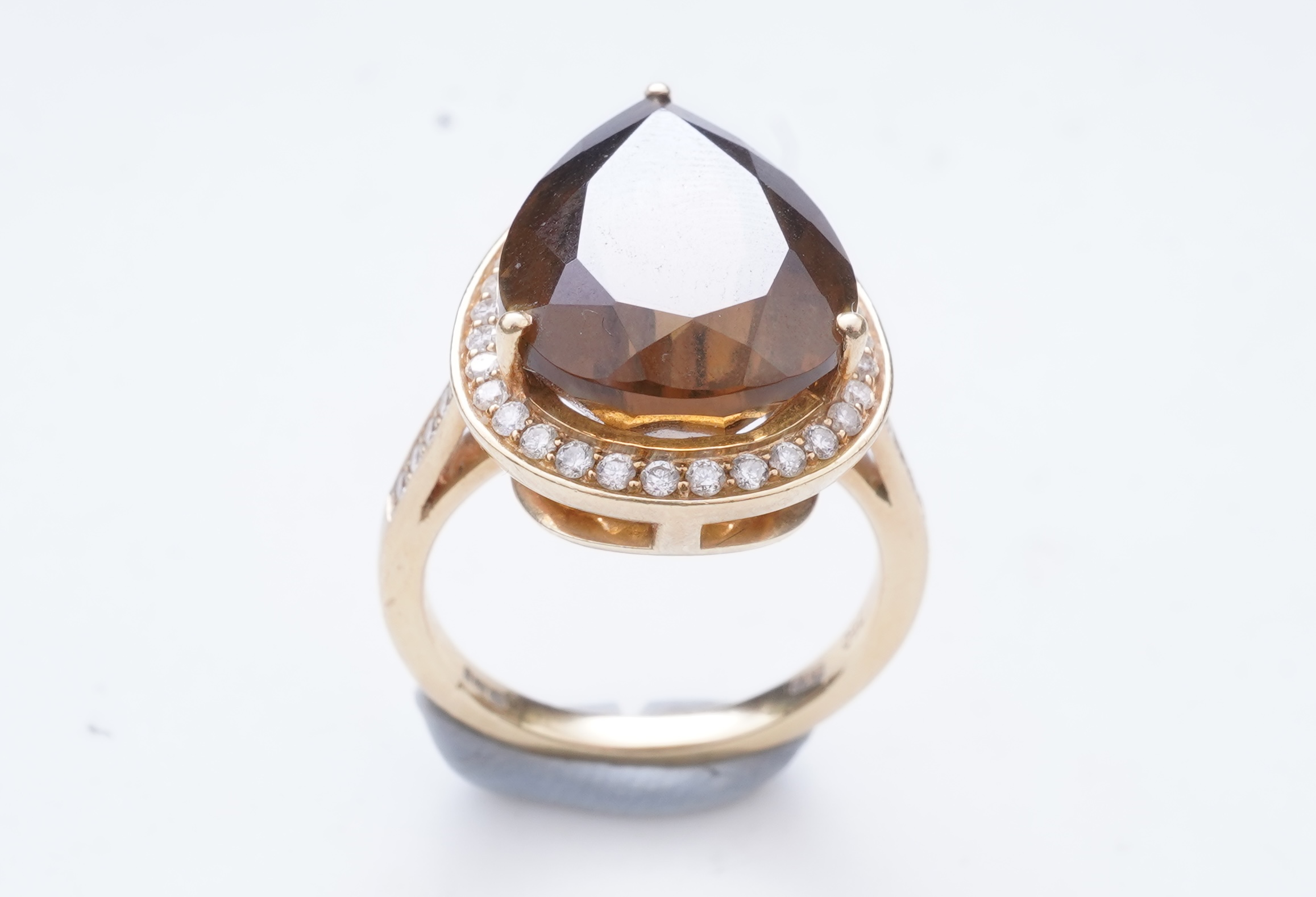 A smoky quartz and diamond ring